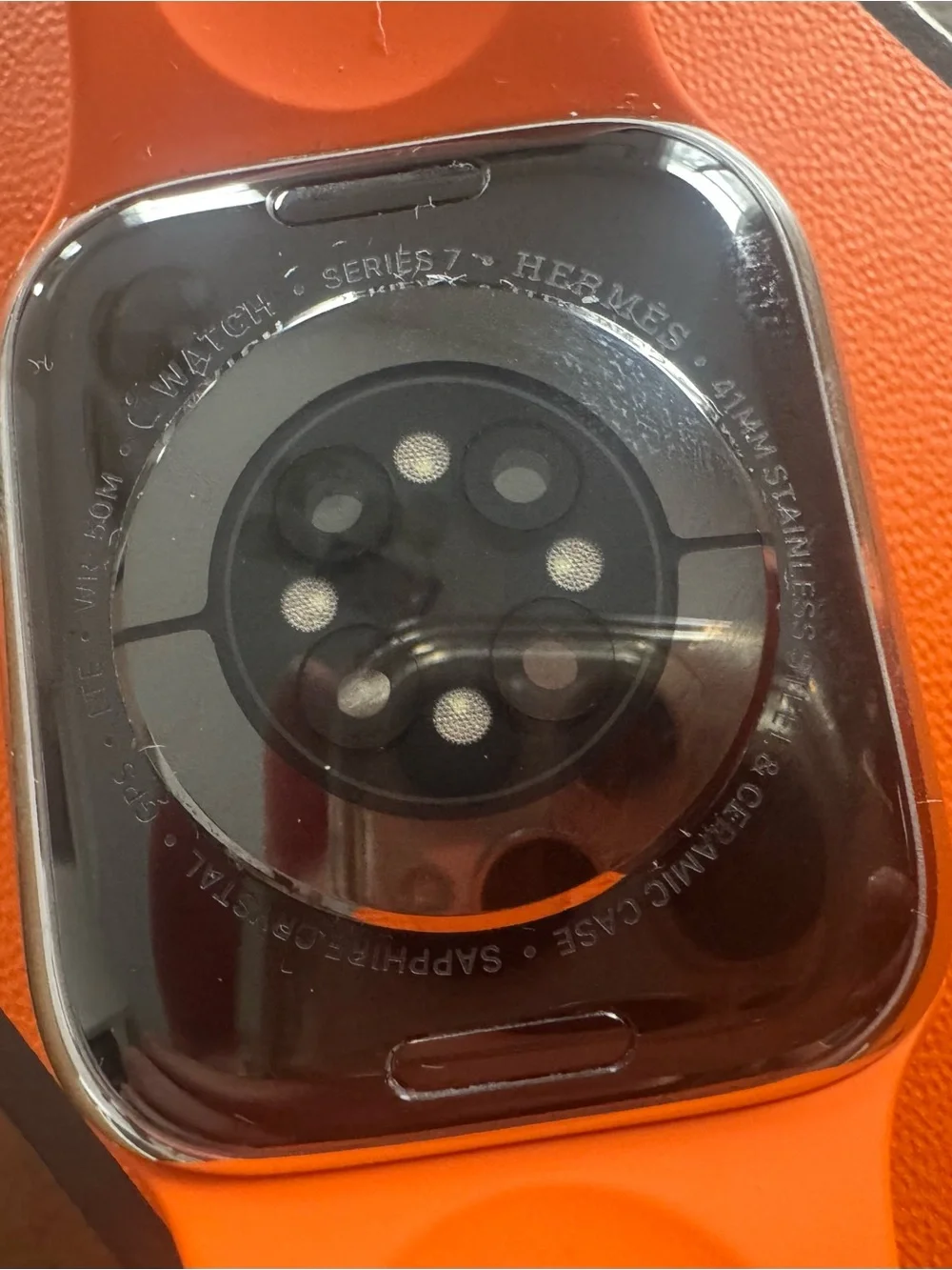 Hermes Apple Watch with orange and double tour leather bands